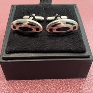 Express silver metal cuff links. Black enamel design. One inch oval. New in box